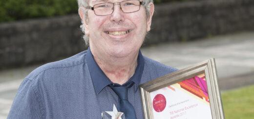 Photo of Paul McMenemy with his award