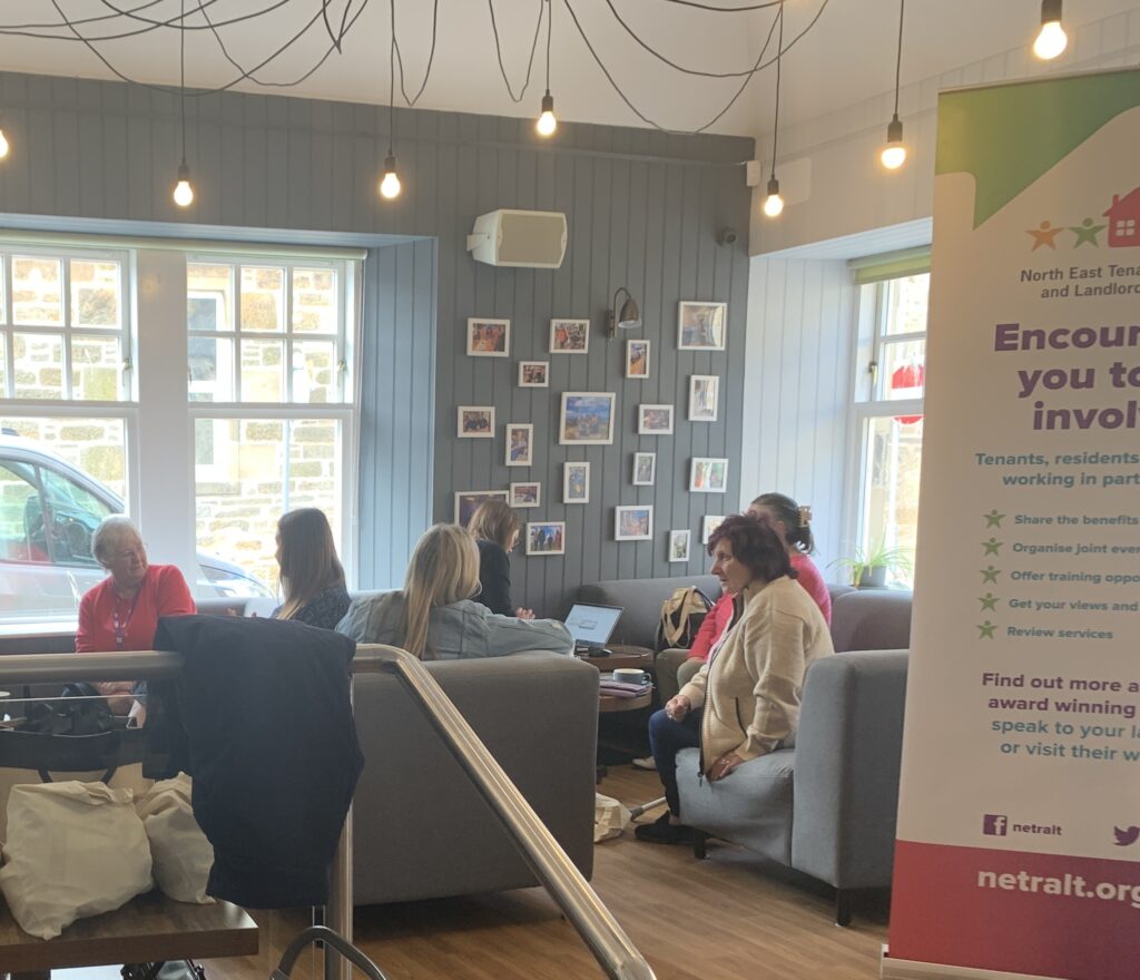 People sitting chatting at a Moray Conversation Cafe