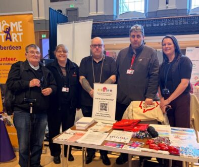 NETRALT members standing at their stall at Empower event