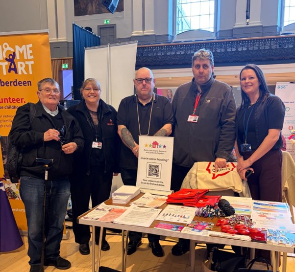 NETRALT members standing at their stall at Empower event